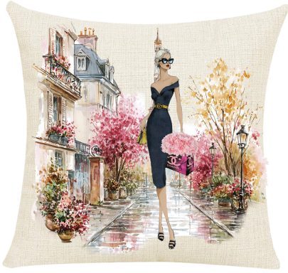 In the Garden Pillow Cover Stylish woman in a black dress walking through a colorful Parisian street in spring.